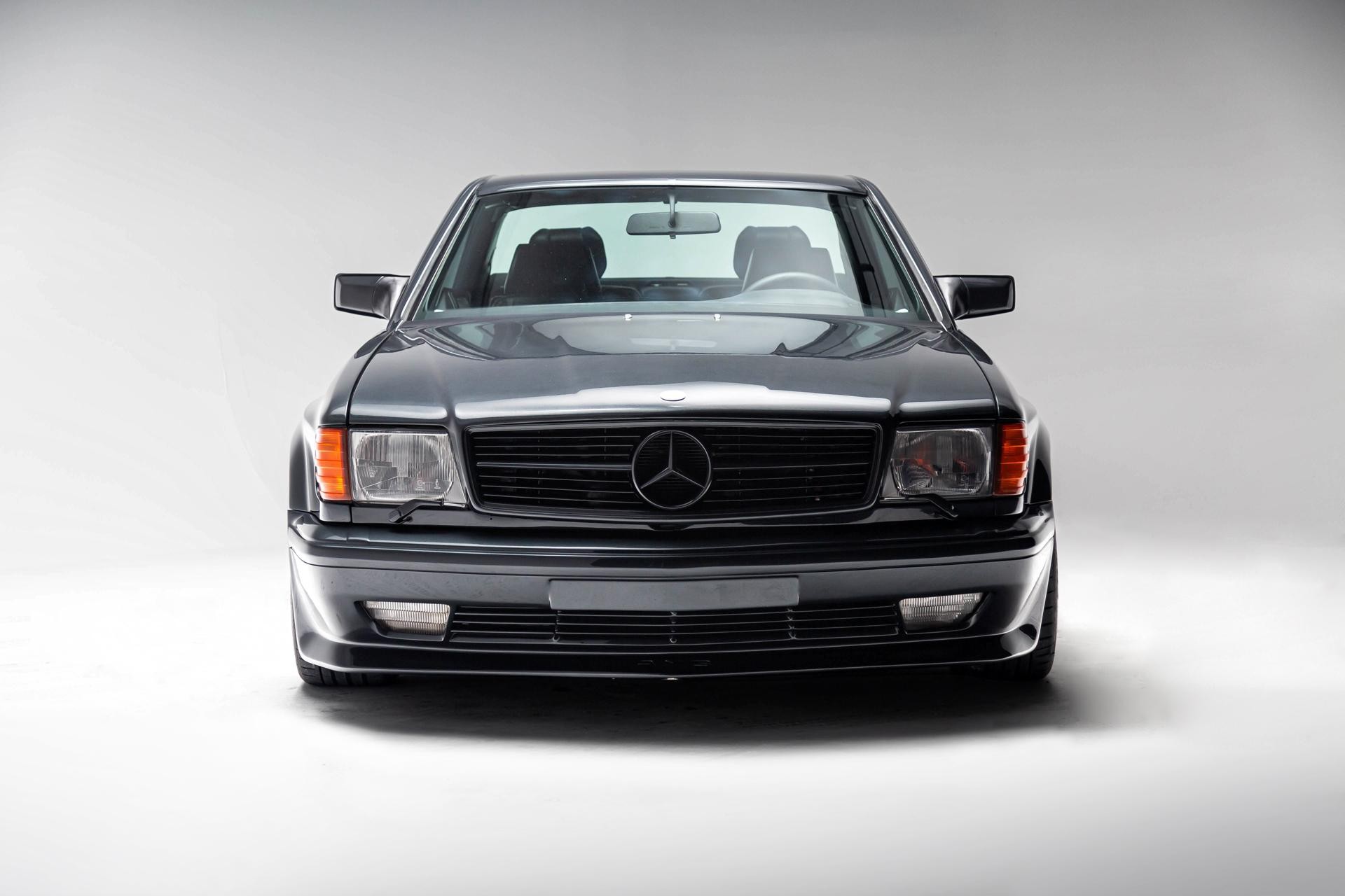 Front view of a 1989 Mercedes-Benz 560 SEC AMG 6.0 Widebody showcasing its iconic design and widebody conversion, a rare classic Mercedes Benz AMG for sale.