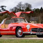 Stunning Fire Engine Red 1954 Mercedes-Benz 300SL Gullwing at Silverstone Auctions, a highly sought-after classic car for collectors