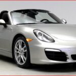 Porsche Boxster with top down, showcasing its convertible design