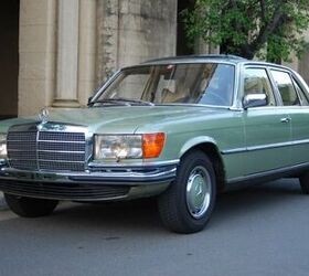 Front three-quarter view of a 1975 Mercedes-Benz 280S in silver, showcasing its classic design and elegant lines.