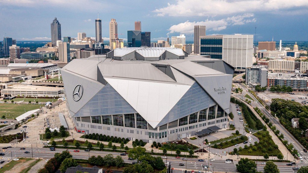 Aerial view of Mercedes-Benz Stadium showcasing its innovative retractable roof and surrounding Atlanta cityscape