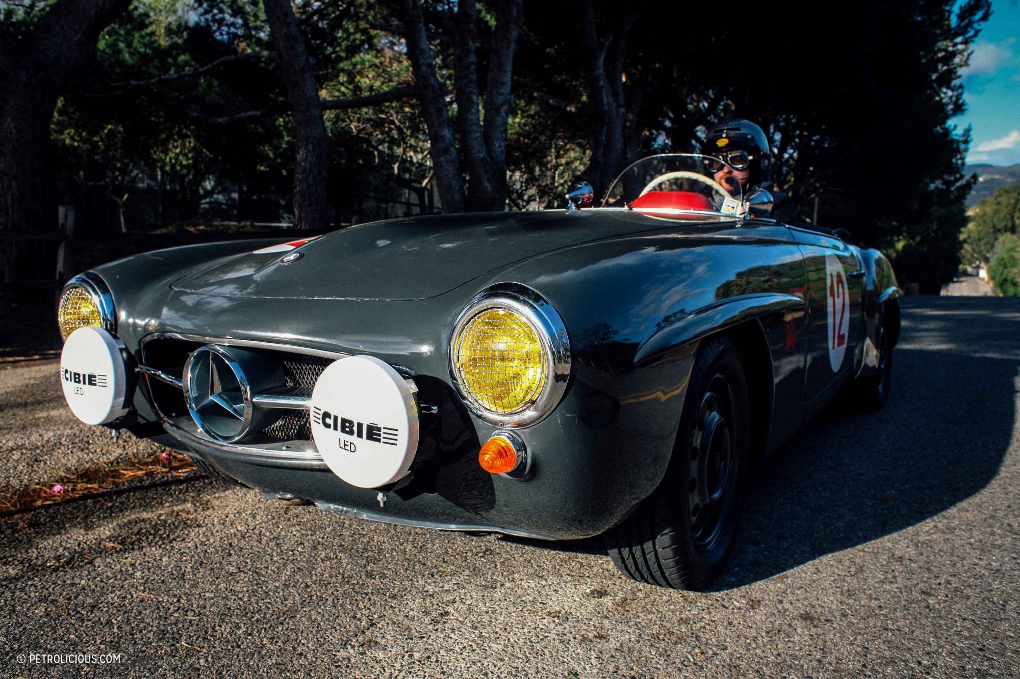 Front view of the dolphin grey Mercedes-Benz 190SL, showcasing its iconic grille and headlights.