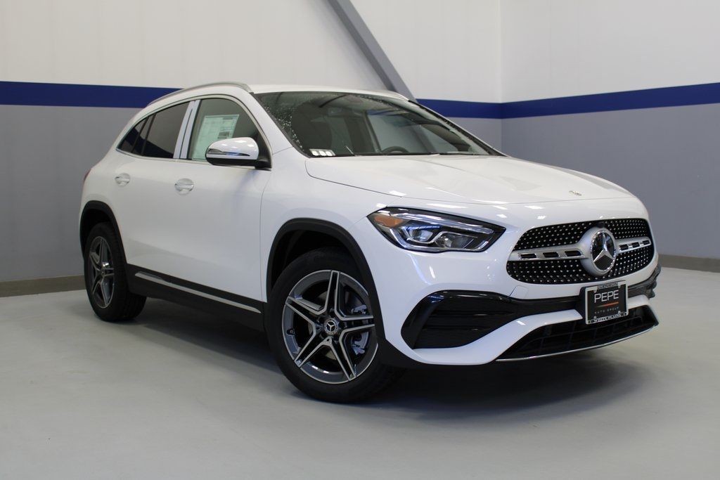 Front view of a white 2023 Mercedes-Benz GLA 250 displayed in a showroom, showcasing its modern and compact SUV styling.