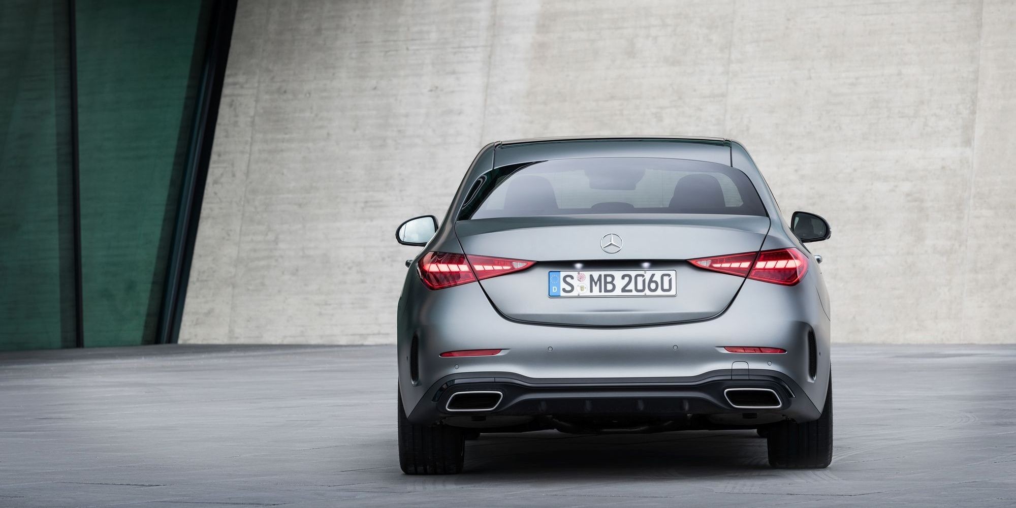 Side profile of a 2021 Mercedes-Benz C-Class sedan, showcasing its elegant lines and resemblance to the flagship S-Class.